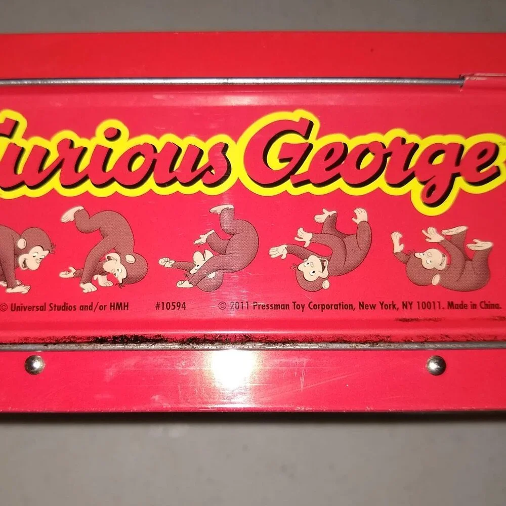 Curious George  Jizsaw puzzle 24 pieces in metal Tin Used